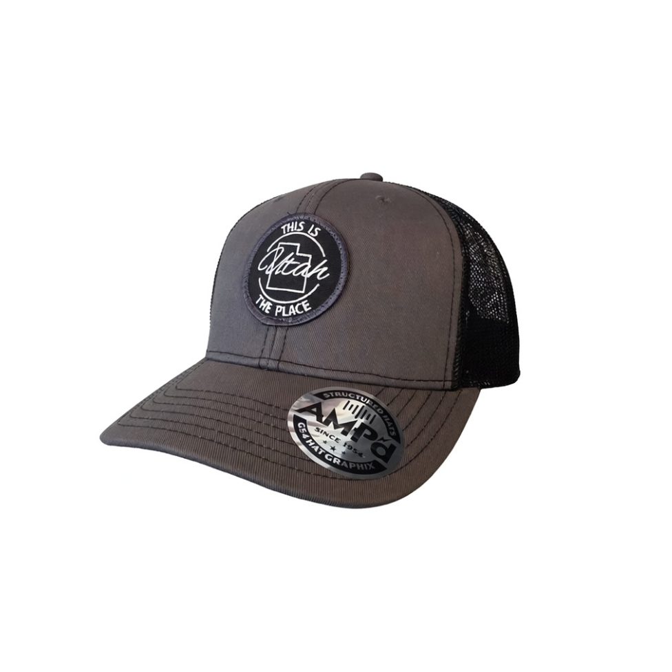 Gray and black This Is The Place Utah trucker hat with embroidered front patch and mesh back