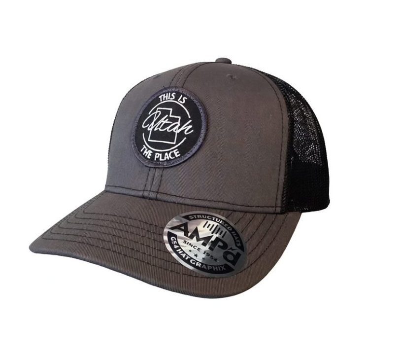 Gray and black This Is The Place Utah trucker hat with embroidered front patch and mesh back